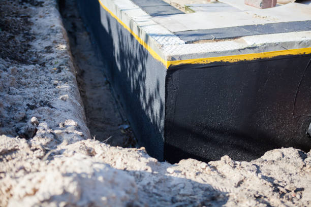 Professional Basement Waterproofing technician working in Blaine, MN